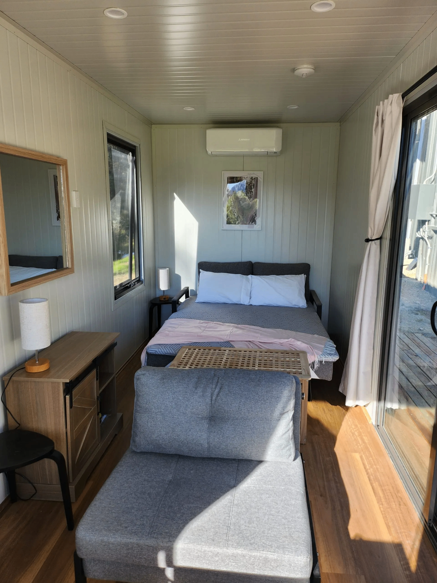 Container home bedroom with sofa bed