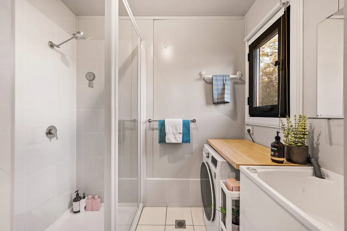 Container home bathroom with laundry