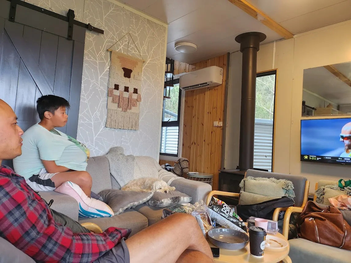 Container home living area with fireplace