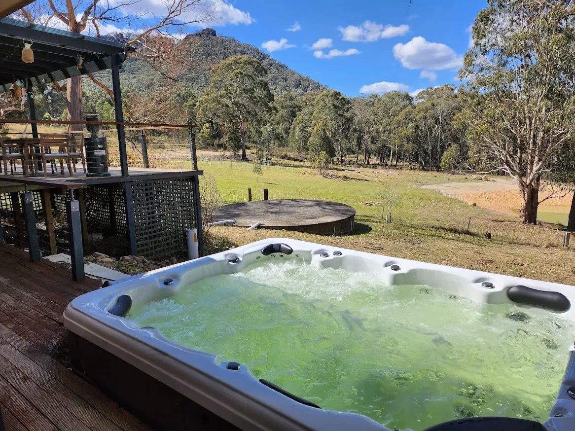 Outdoor jacuzzi with mountain views