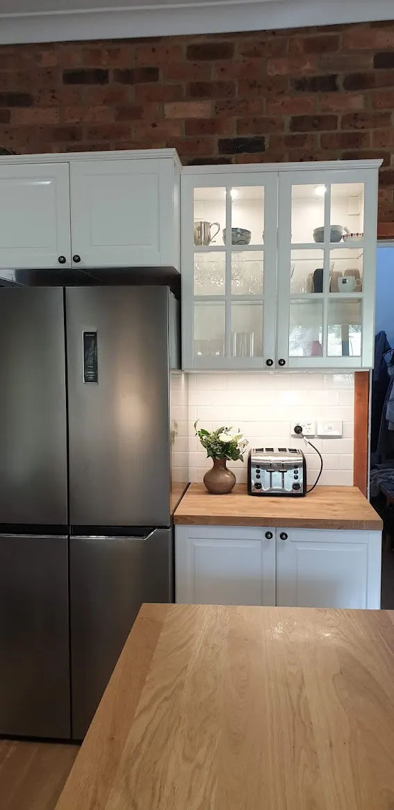 Kitchen with brick feature wall